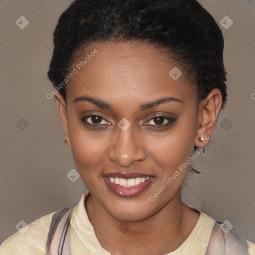 Joyful black young-adult female with short  brown hair and brown eyes