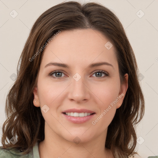 Joyful white young-adult female with medium  brown hair and green eyes