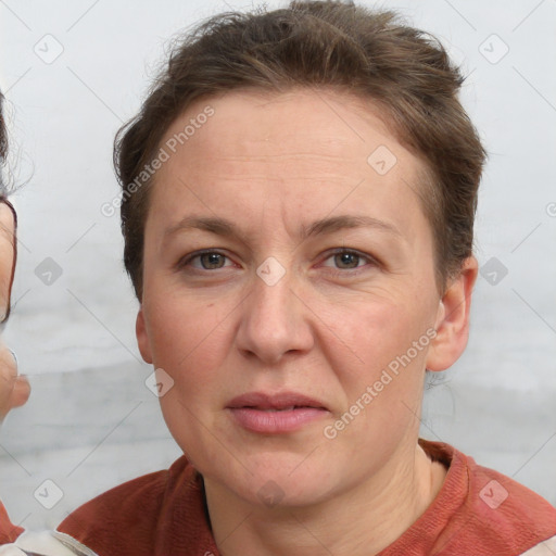 Joyful white adult female with short  brown hair and grey eyes