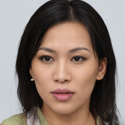Neutral asian young-adult female with medium  brown hair and brown eyes