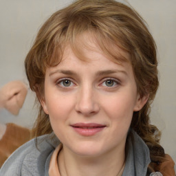 Joyful white young-adult female with medium  brown hair and blue eyes