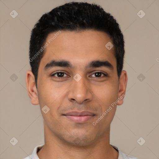Joyful latino young-adult male with short  black hair and brown eyes