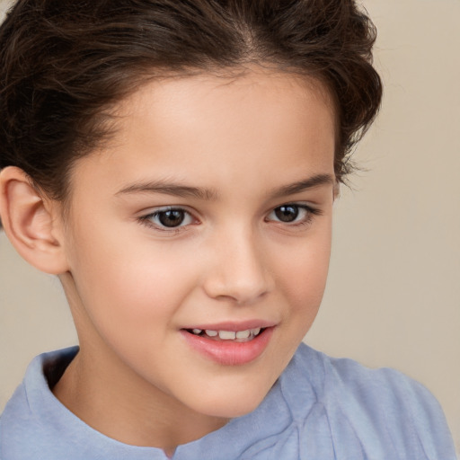 Joyful white child female with short  brown hair and brown eyes