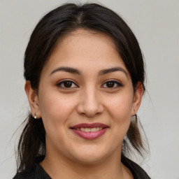 Joyful white young-adult female with medium  brown hair and brown eyes