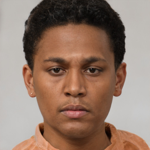 Neutral latino young-adult male with short  brown hair and brown eyes