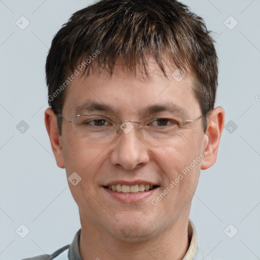 Joyful white adult male with short  brown hair and brown eyes