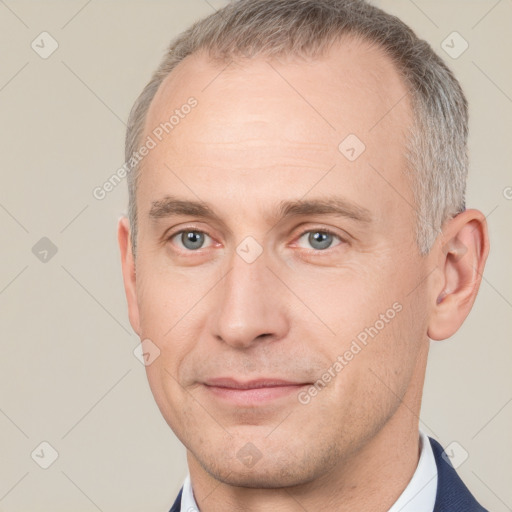 Joyful white adult male with short  brown hair and grey eyes