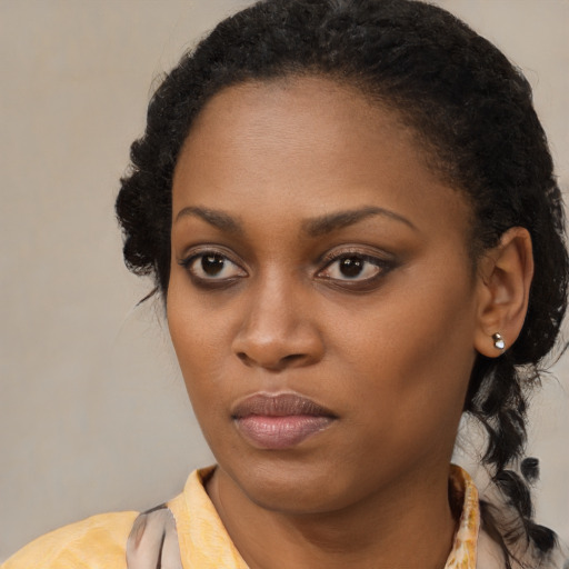 Neutral black young-adult female with medium  black hair and brown eyes