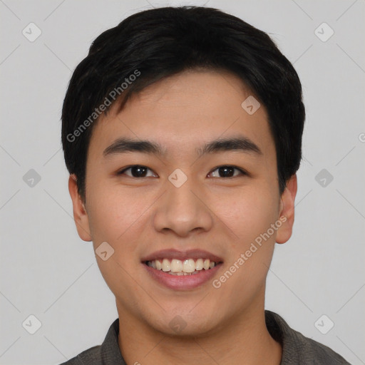 Joyful asian young-adult male with short  black hair and brown eyes