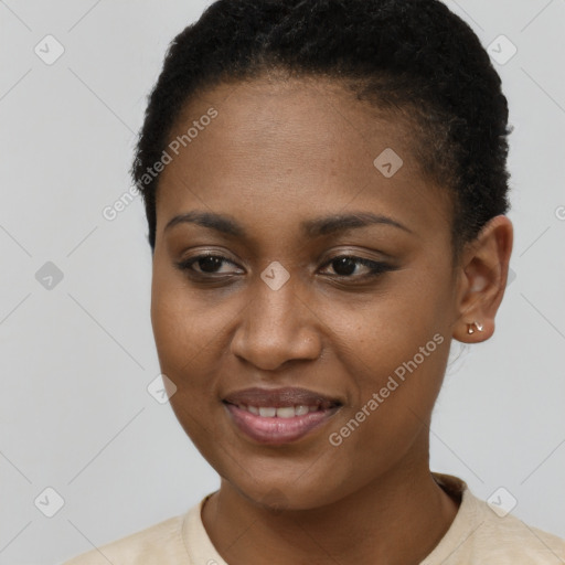 Joyful black young-adult female with short  brown hair and brown eyes