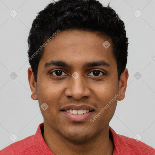 Joyful black young-adult male with short  black hair and brown eyes