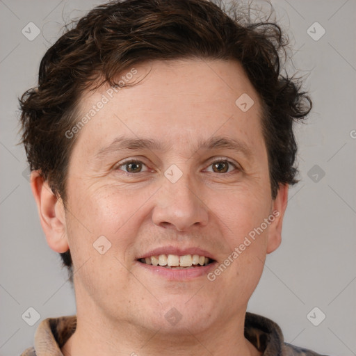 Joyful white adult male with short  brown hair and grey eyes