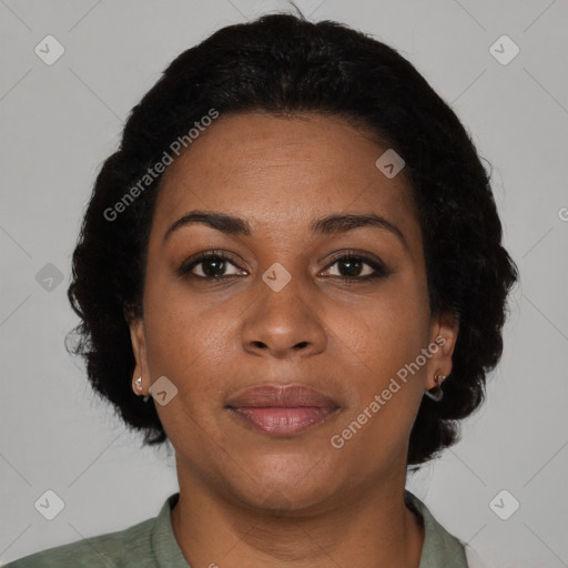 Joyful black adult female with short  brown hair and brown eyes