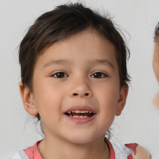 Joyful white child male with medium  brown hair and brown eyes