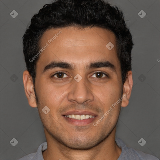 Joyful white young-adult male with short  black hair and brown eyes