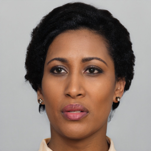 Neutral latino young-adult female with short  black hair and brown eyes