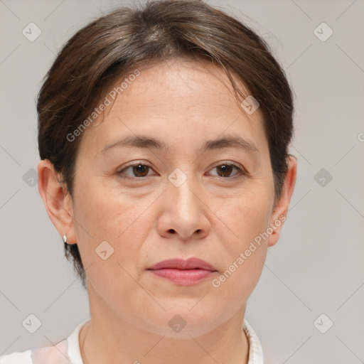 Joyful white adult female with short  brown hair and brown eyes