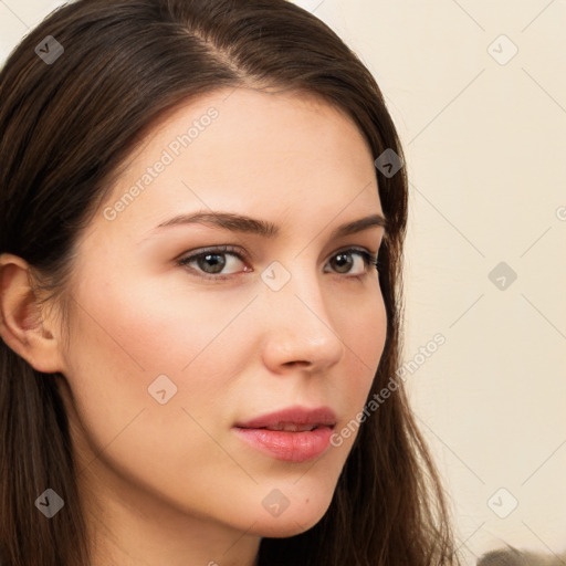 Neutral white young-adult female with long  brown hair and brown eyes