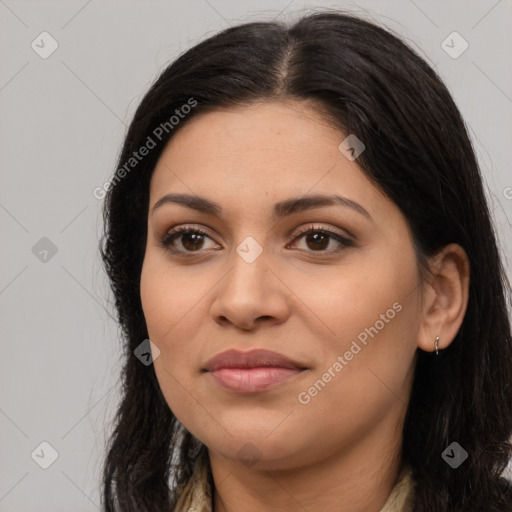 Joyful latino young-adult female with long  brown hair and brown eyes