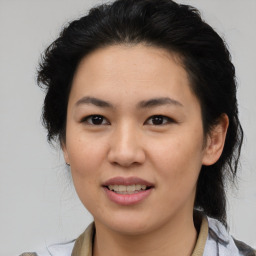 Joyful asian young-adult female with medium  brown hair and brown eyes