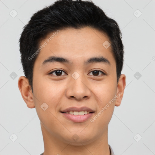 Joyful asian young-adult male with short  brown hair and brown eyes