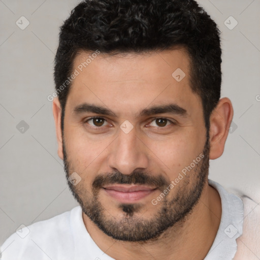 Joyful white young-adult male with short  black hair and brown eyes