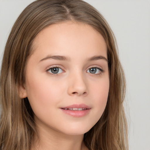 Joyful white child female with long  brown hair and brown eyes