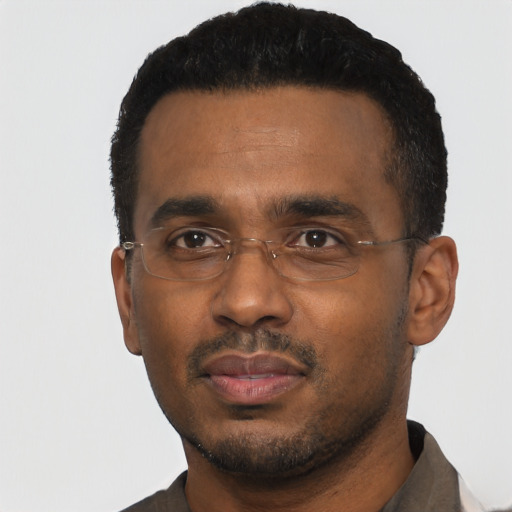 Neutral black adult male with short  black hair and brown eyes