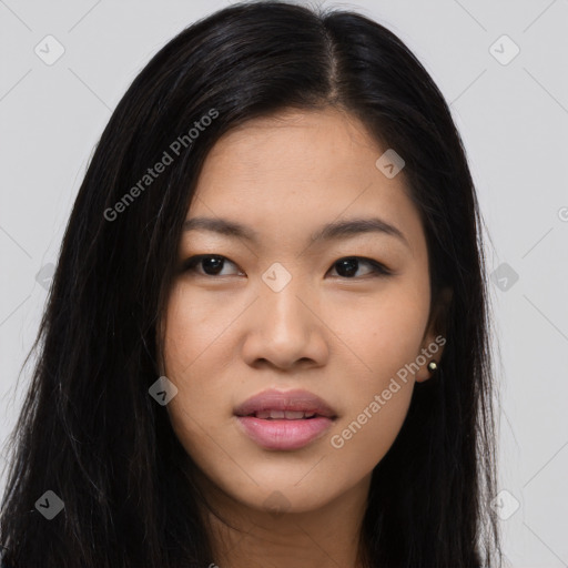 Joyful asian young-adult female with long  brown hair and brown eyes