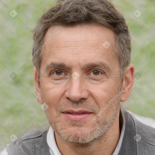 Joyful white middle-aged male with short  brown hair and brown eyes