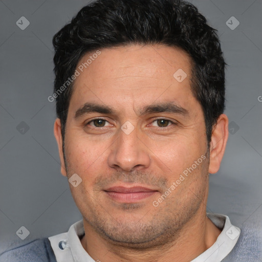 Joyful white adult male with short  black hair and brown eyes