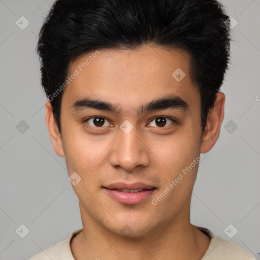 Joyful asian young-adult male with short  black hair and brown eyes