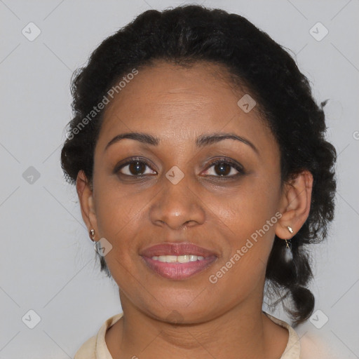 Joyful black young-adult female with short  brown hair and brown eyes