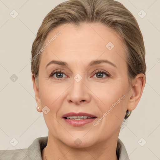 Joyful white adult female with short  brown hair and brown eyes