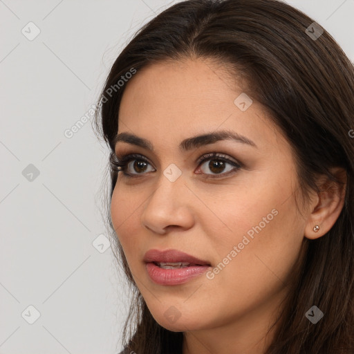 Joyful white young-adult female with long  brown hair and brown eyes