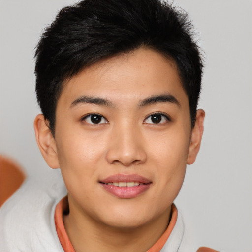 Joyful asian young-adult female with short  brown hair and brown eyes