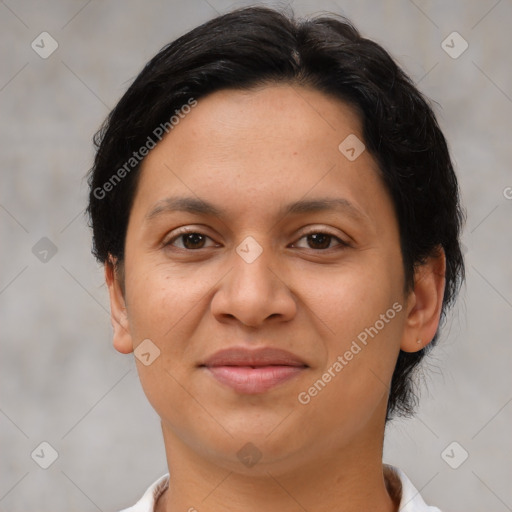 Joyful latino young-adult female with short  brown hair and brown eyes