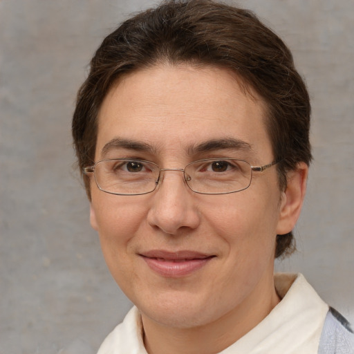 Joyful white adult female with short  brown hair and brown eyes