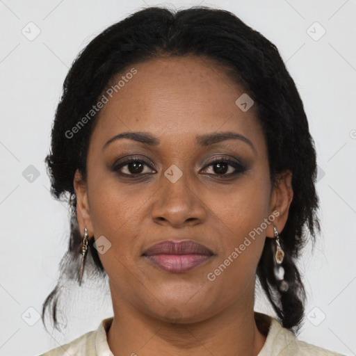 Joyful black adult female with medium  brown hair and brown eyes