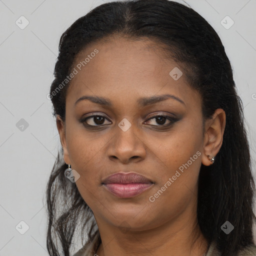 Joyful black young-adult female with long  black hair and brown eyes