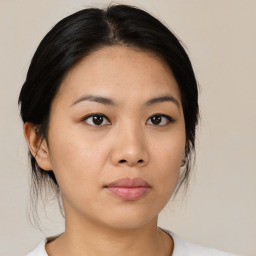 Neutral asian young-adult female with medium  black hair and brown eyes