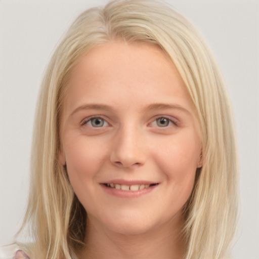 Joyful white young-adult female with long  brown hair and blue eyes