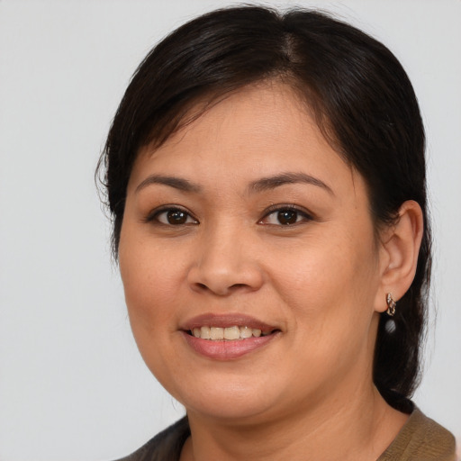 Joyful asian young-adult female with medium  brown hair and brown eyes