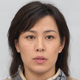 Neutral asian young-adult female with medium  brown hair and brown eyes