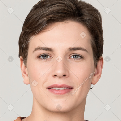 Joyful white young-adult female with short  brown hair and grey eyes