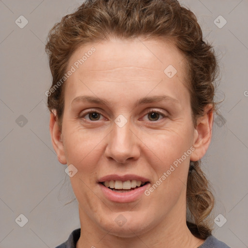 Joyful white adult female with short  brown hair and brown eyes