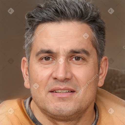 Joyful white adult male with short  brown hair and brown eyes