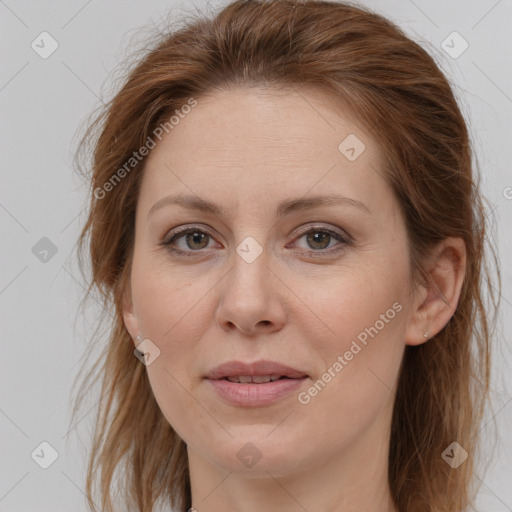 Joyful white adult female with long  brown hair and grey eyes