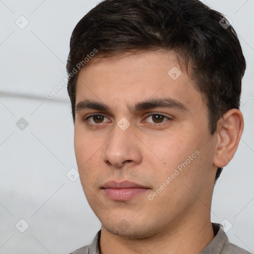 Neutral white young-adult male with short  brown hair and brown eyes