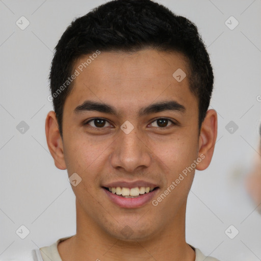 Joyful latino young-adult male with short  brown hair and brown eyes